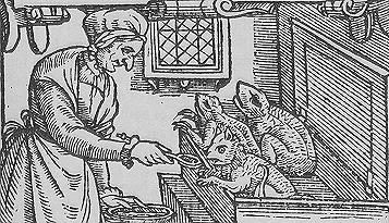 An elderly witch feeds her satanic 'familiars'